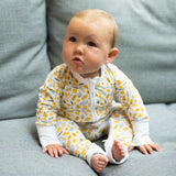 The Woodland Leaves ZippySuit. The perfect baby grow has a 2-way zip for quick and easy changes, foldable mitts and foldable feet pouches.